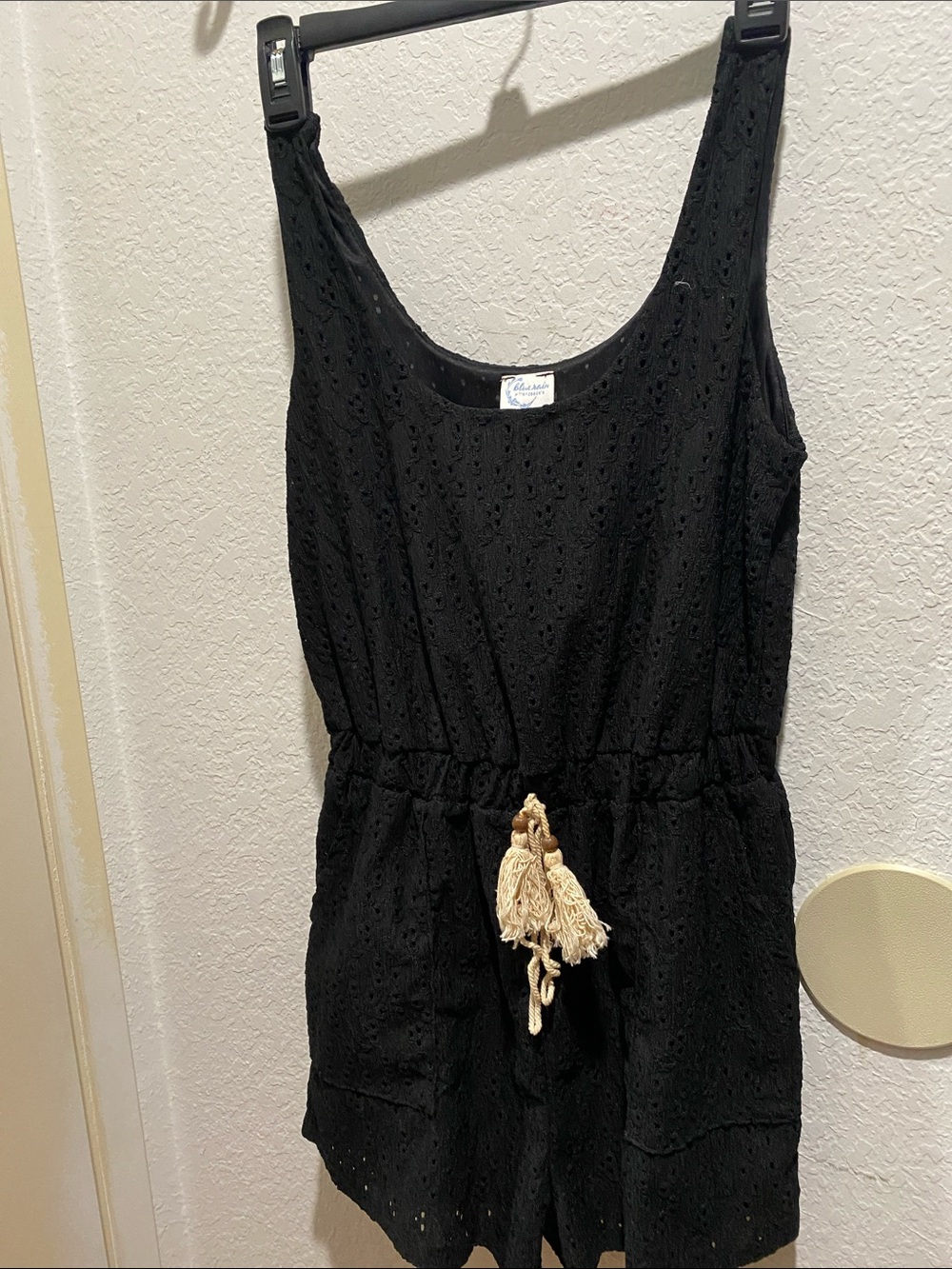 Francesca's Collections Black Eyelet Mini Romper with Cream Tassel Tie